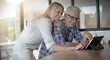 © goodluz - couple consulting internet on a tablet