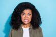 © deagreez - Photo of young african lady scared panic dislike horrified anxious isolated over blue color background