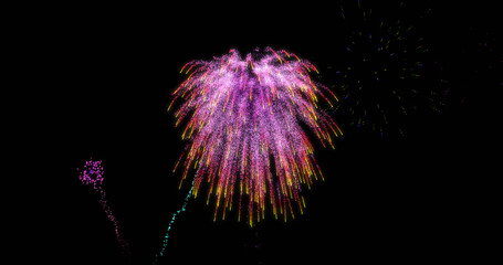 image of colourful christmas and new year fireworks exploding in night sky