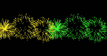 image of yellow and green christmas and new year fireworks exploding in night sky