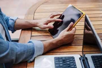 Male professional working on digital tablet at backyard