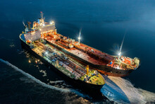 Two Tankers At Night, Stand Nearby In Young Ice. Shooting From Air.