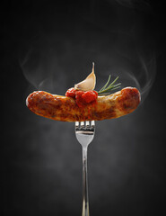 Wall Mural - grilled fresh and hot sausage with tomato sauce and garlic