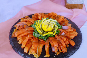 Wall Mural - Smoked salmon with lemon on cutting board.