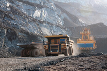 Open Cast Mine Dump Trucks Drive Alone Industrial Area Of Iron Ore Quarry