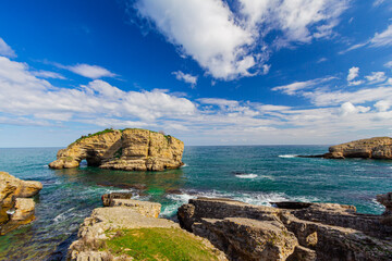 Sardala Bay, Perforated rock, cloudy blue sky. Kandira Kocaeli, Turkey