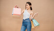 Portrait of happy beautiful shopaholic asian woman carry shopping bags, summer fashion sale model Asia girl with copy space, outlet sale department store advertising concept isolated banner background