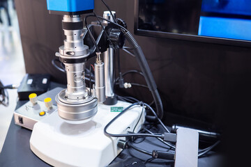 Poster - Laboratory electron microscope. Microscope and many wires in a medical laboratory. Modern laboratory equipment. Electronic equipment for a medical lab. Scientist electron microscope.