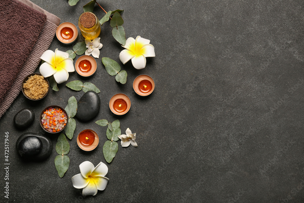 Beautiful spa composition with burning candles on dark background