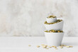 © Pixel-Shot - Bowls with pumpkin seeds on table