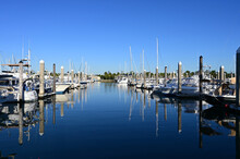 Boats Docked In Marina In Key Biscayne, Florida In Early Morning Light On Clear Autumn Day.