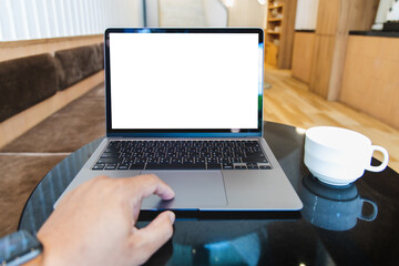 Poster - Blank screen laptop computer modern man use room laptop with blank white desktop screen with coffee cup on wooden table in cafe