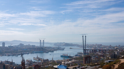 Fototapete - Vladivostok cityscape. Construction of the bridge.