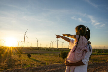wind turbines are alternative electricity sources, the concept of sustainable resources, people in t