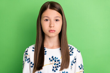 portrait of charming kid girl wearing flower print outfit look in camera isolated over green color b