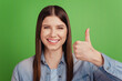 © Tetiana - Photo of young cheerful girl show thumb-up approve great perfect isolated over green color background