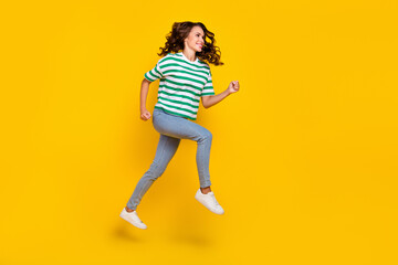 Sticker - Full body photo of cute brunette millennial lady run wear t-shirt jeans shoes isolated on yellow background