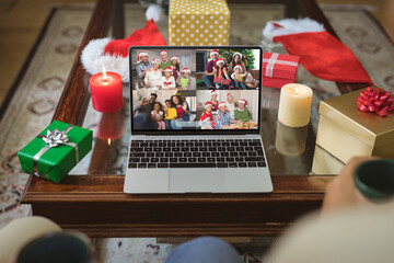 Poster - Four happy diverse families at christmas smiling on laptop group video call screen