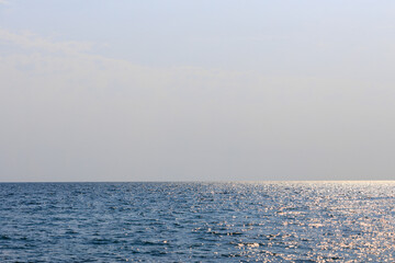 Poster - blue sea with clear skies. white space