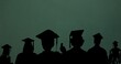 Silhouette male and female students wearing mortarboards against green background with copy space
