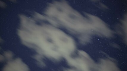 Wall Mural - Tracking time lapse of the Great Nebula in Orion beyond fast moving clouds