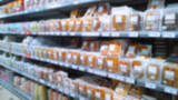 Fototapeta  - Abstract blur image of supermarket background. Defocused shelves with food. Grocery shopping. Store. Retail place. Rack. Discount price. Inflation and economic crisis concept. Aisle. Merchandise.