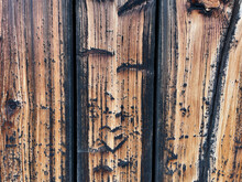 Old Weathered Wood With Patina And Carved Heart. Wood Plank Wall, Pattern For Design And Decoration. Close Up.