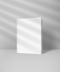 Poster - White book with blank hard cover mockup with sun flare effect. Light of the window with blinds