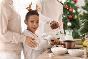 Poster - African-American family preparing tasty hot chocolate in kitchen on Christmas eve