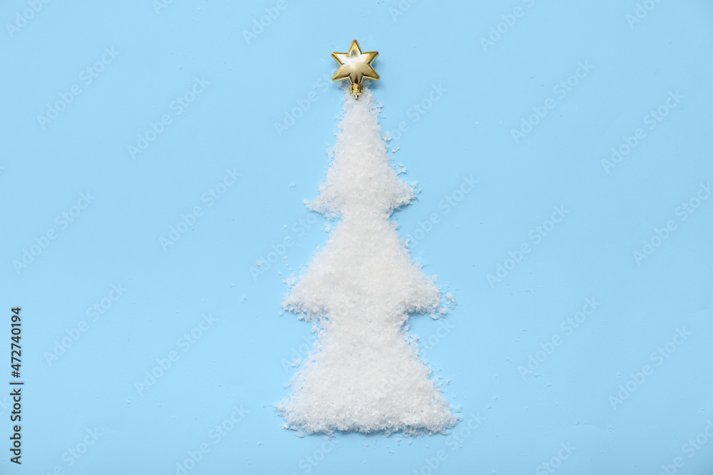 Christmas tree made of snow on color background