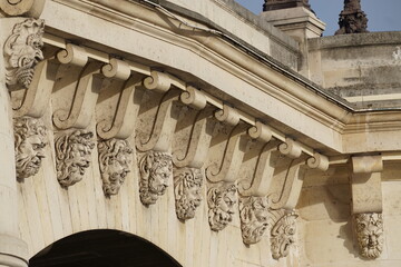 Wall Mural - detail of the faces of the facade of Pont Neuf  paris france