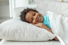Little Kid Boy Lying In His Bed And Smiling. Bedtime