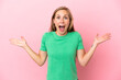 Young English woman isolated on pink background with shocked facial expression