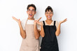 © luismolinero - Restaurant mixed race waiters isolated on white background with surprise and shocked facial expression
