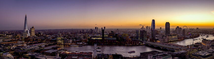 Wall Mural - Wide panorama of the skyline of London, UK, during dusk: from London Bridge along the Thames river to Westminster