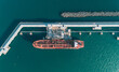 © Evgenii Bakhchev - Aerial top down view of an oil tanker ship in process of loading