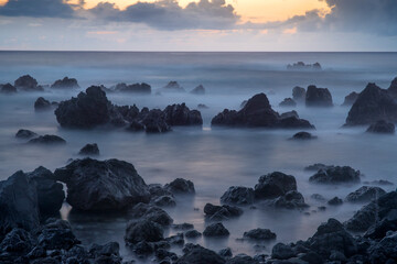 Sticker - USA, Hawaii, Big Island of Hawaii. Laupahoehoe Point Beach Park, Dawn sky over waves and rough volcanic rock.