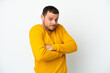 © luismolinero - Young Brazilian man isolated on white background making doubts gesture while lifting the shoulders
