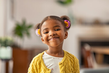 cute little african american girl looking at camera