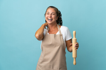 Wall Mural - Middle age woman in chef uniform laughing