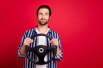 Poster - Photo of minded guy taxi rider look empty space ride road trip isolated over red shine color background