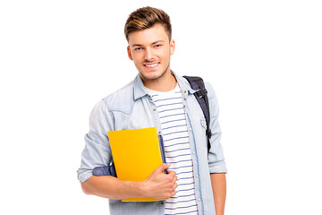 Confident student. Studio portrait of handsome young man holding books. Isolated on white.