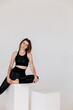 © kalinichenkod - Sexy fitness woman. Beautiful athletic girl on the gray background