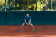 © qunica.com - Focused male athlete waiting to receive the ball in a professional tennis game