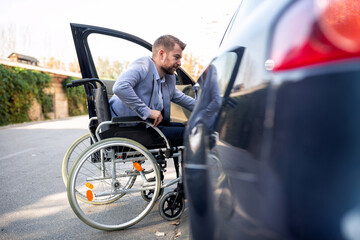 Handicapped man attempting to get in the car