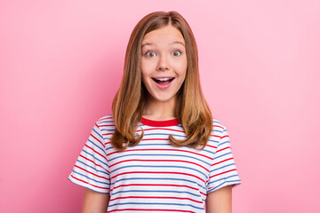 Wall Mural - Photo of impressed teen girl open mouth wear striped t-shirt isolated on pink color background