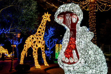 Wall Mural - The Very beautiful Christmas lights in Gaeta, fairy tales of light 2019, Gaeta, Lazio, Italy. Representation of hippo and giraffe