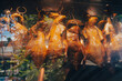 Famous vietnamese roasted ducks called Vit quay displayed behind a glass covered street food stall in Hanoi, Vietnam