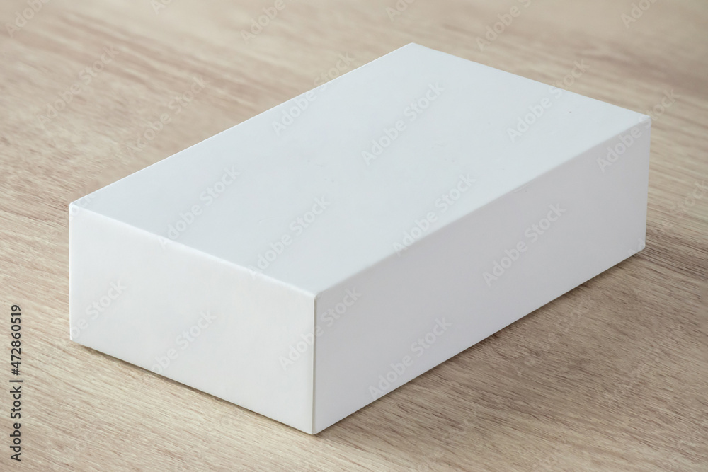 Mockup white box on wood table background Stock Photo | Adobe Stock