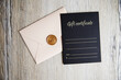 Decorative beige envelope, 
gift certificate and black letterhead with Gift Certificate and space for text, gift voucher, vacertificate close-up.